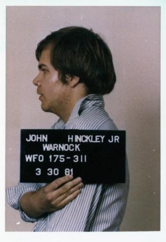 John Hinkley Jr. poses for his mugshot after he was apprehended