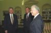 President Clinton talking with former President George H.W. Bush and former President Jimmy Carter in the Oval Office. The President and former Presidents gather following the Middle East Peace Agreement signing ceremony, September 13, 1993.