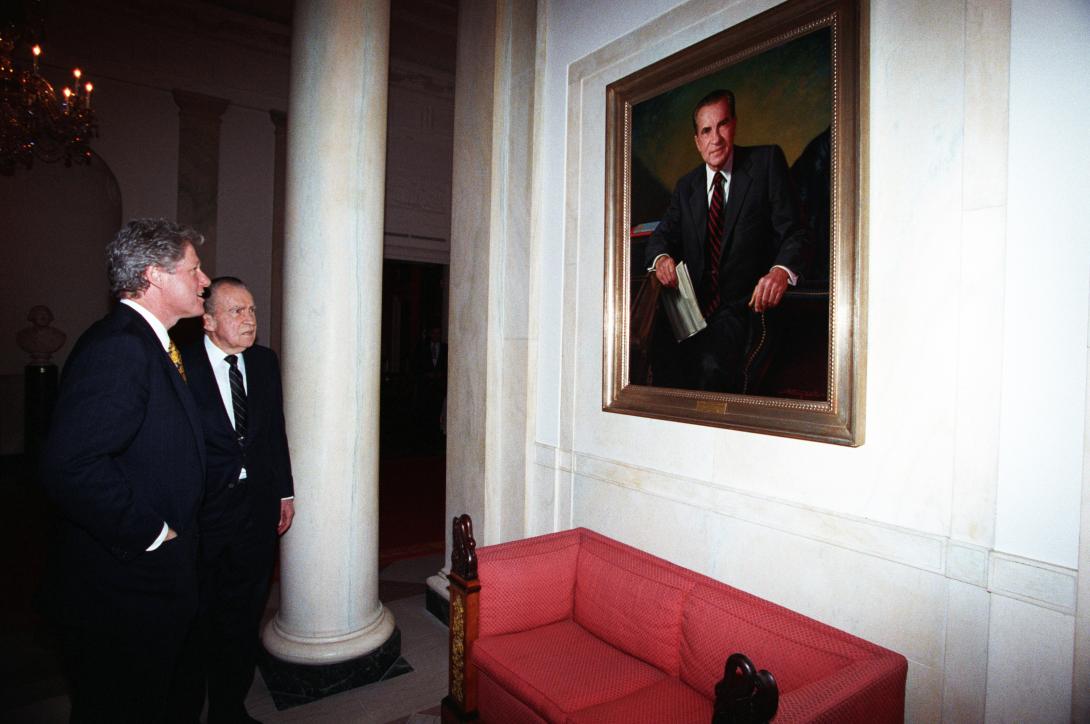 President Clinton and President Nixon view the portrait of President Nixon that hangs in the White House