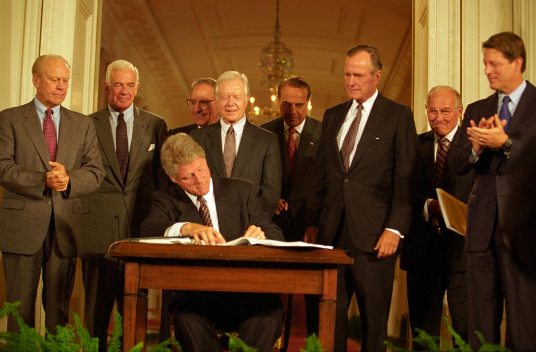 President Clinton signs NAFTA with former Presidents Gerald Ford, Jimmy Carter, and George H.W. Bush present