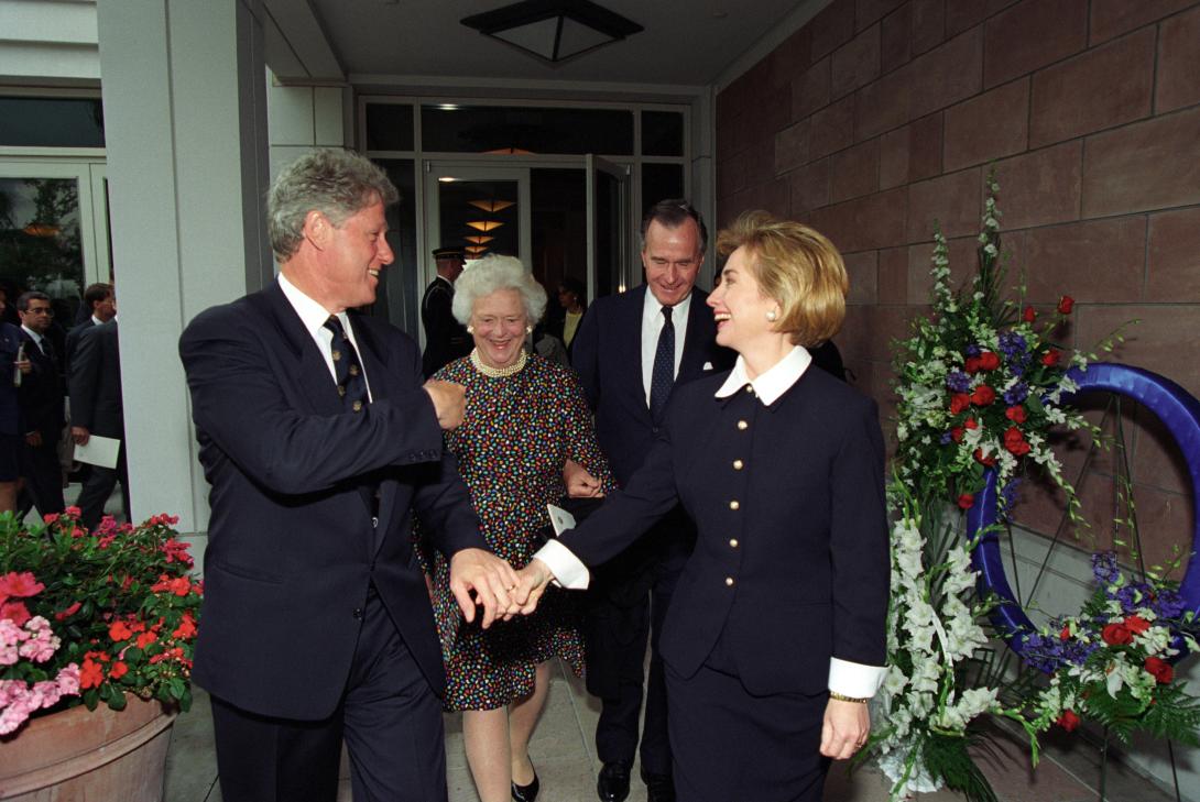 President Clinton and First Lady Hillary Rodham Clinton walking to a reception following the funeral of President Richard Nixon with former President George H.W. Bush and First Lady Barbara Bush. 