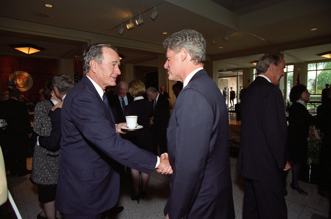 President Clinton greets Former President Bush at Former President Richard Nixon's funeral service in Yorba Linda, California.