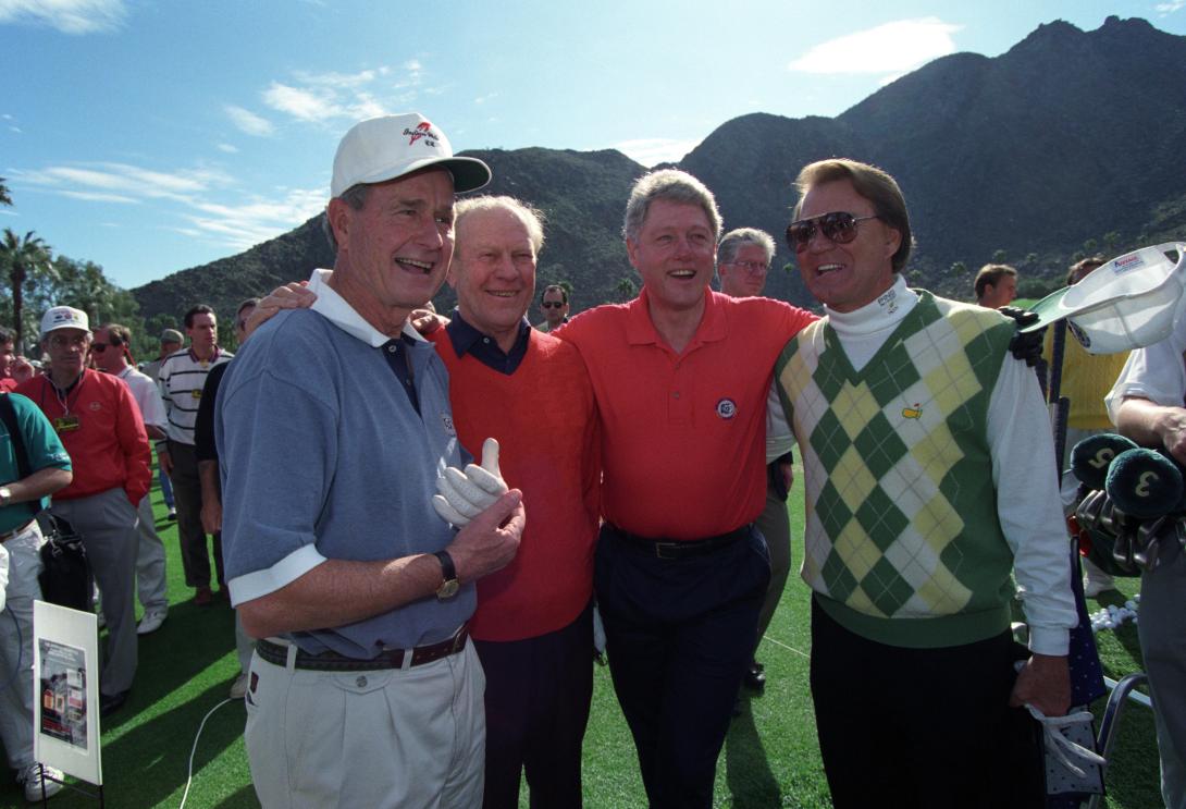 Glen Campbell, Bill Clinton, Gerald Ford, and George H. W. Bush after playing a round of golf at the Bob Hope Chrysler Classic in California.