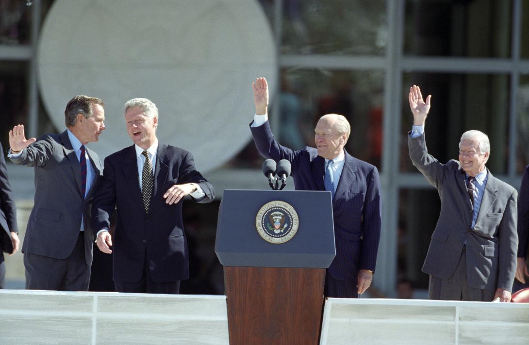 President Clinton, Former President's George H.W. Bush, Jimmy Carter and Gerald Ford waving to the crowd at the George Bush Library Dedication Ceremony in College Station, Texas.