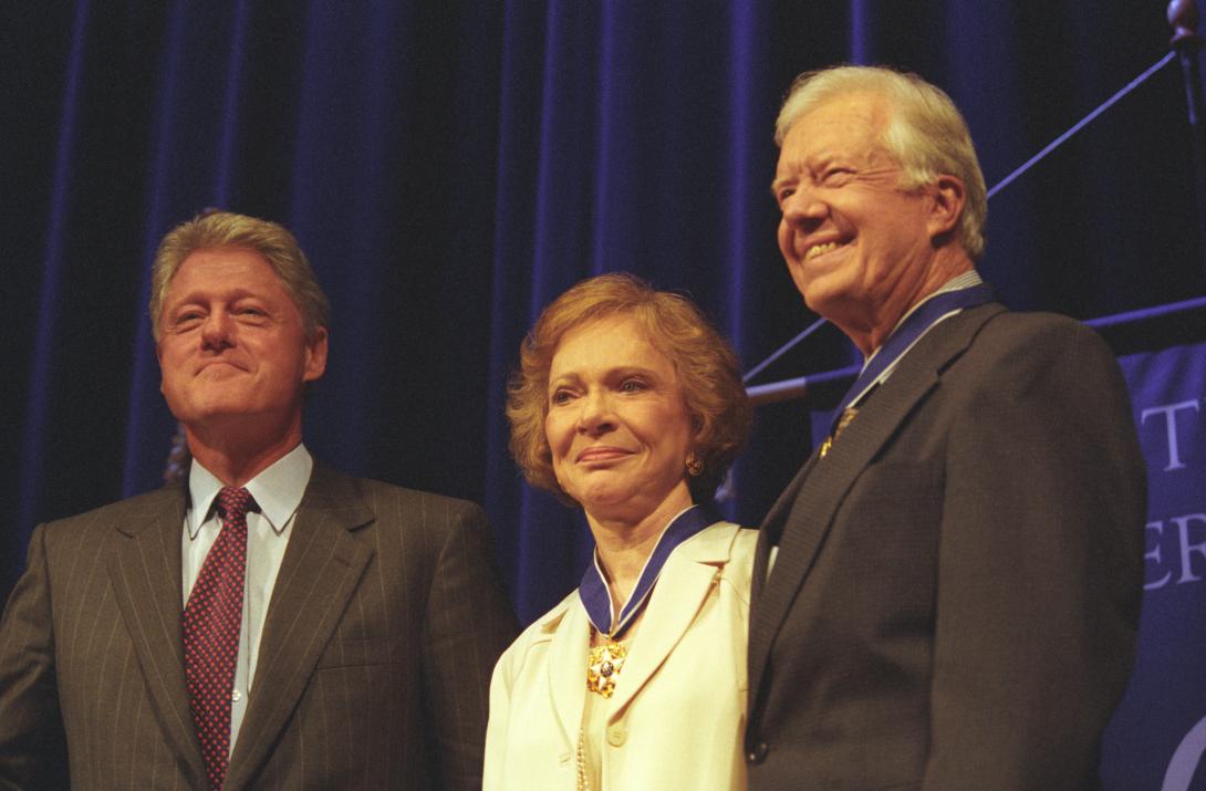 President Clinton visiting with former President Jimmy Carter and First Lady Rosalynn Carter during the Medal of Freedom ceremony at the Carter Center in Atlanta, Georgia.