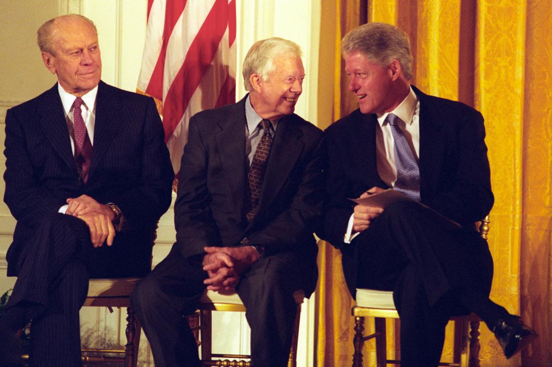 President Clinton talking with former President Jimmy Carter and Former President Gerald R. Ford during the Permanent Normal Trade Relations with China event in the East Room.